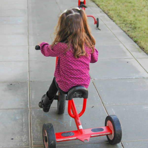 sip-day-school-preschooler-riding-tricycle