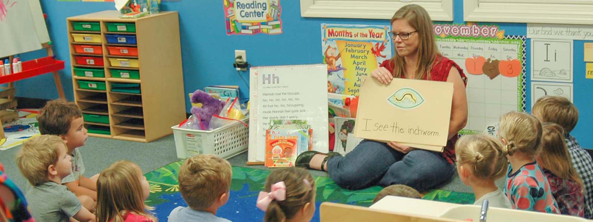 Preschool Teacher leading a class during circle time.